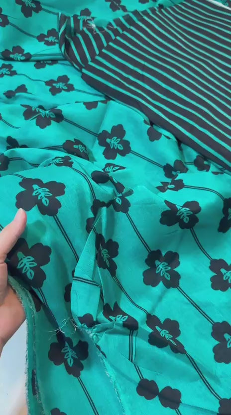 unstitched printed 2-piece lawn suits for just Rs. 1,400.